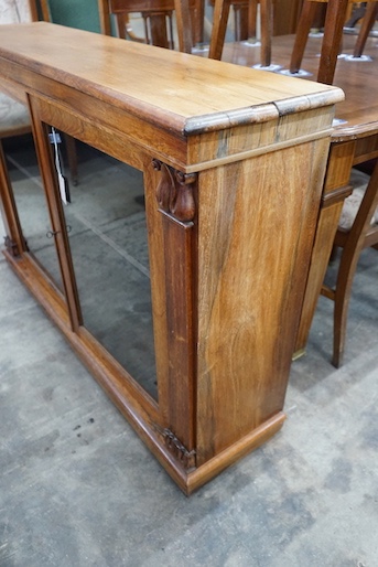 A Victorian and later faded rosewood two door bookcase, width 132cm, depth 33cm, height 90cm